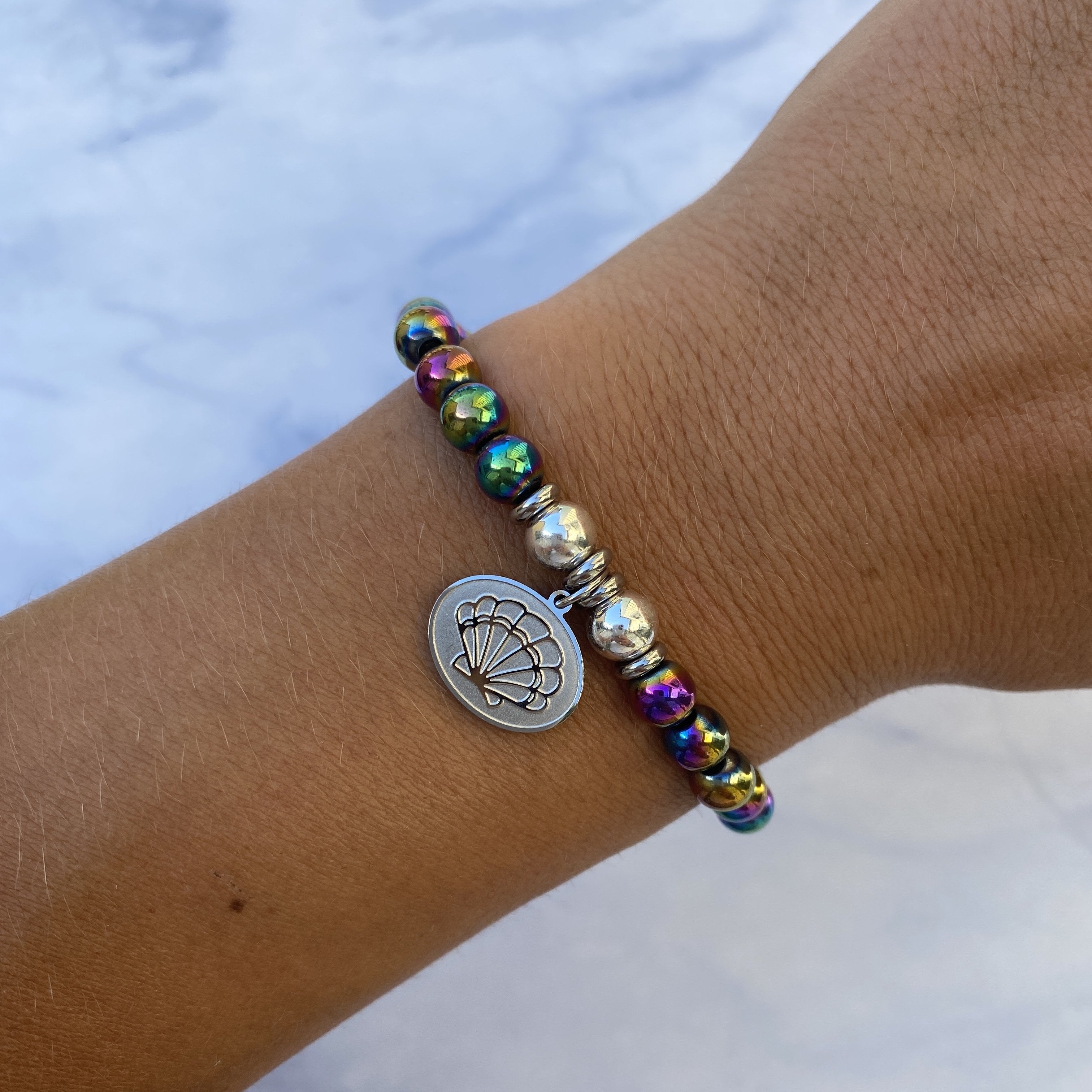 HELP by TJ Seashell Charm with Rainbow Hematite Beads Charity Bracelet